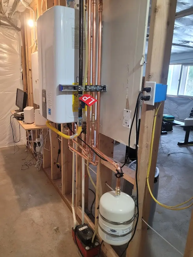 Licensed plumber repairing a kitchen sink in Manchester