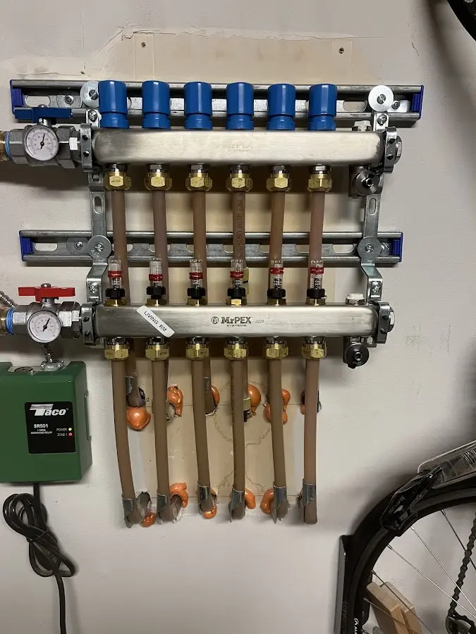 Plumber performing Gas Line Installation at a residential property in Manchester